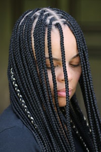 a woman with black braids on her head