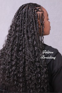 the back view of a black woman with curly hair